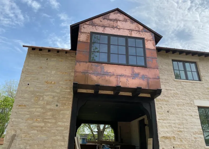 Copper metal panel facade on a stone building for Skylight Installation in Dale City